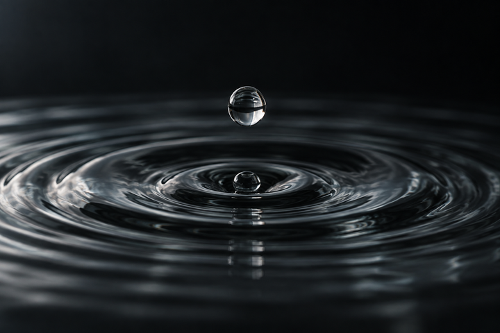 Conceptual illustration of a droplet and water ripples